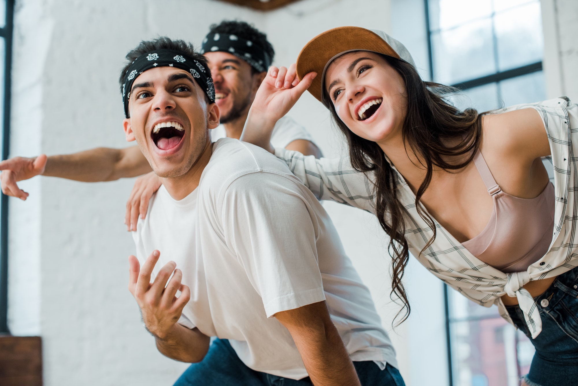 selective-focus-of-cheerful-multicultural-dancers-laughing-in-dance-studio.jpg